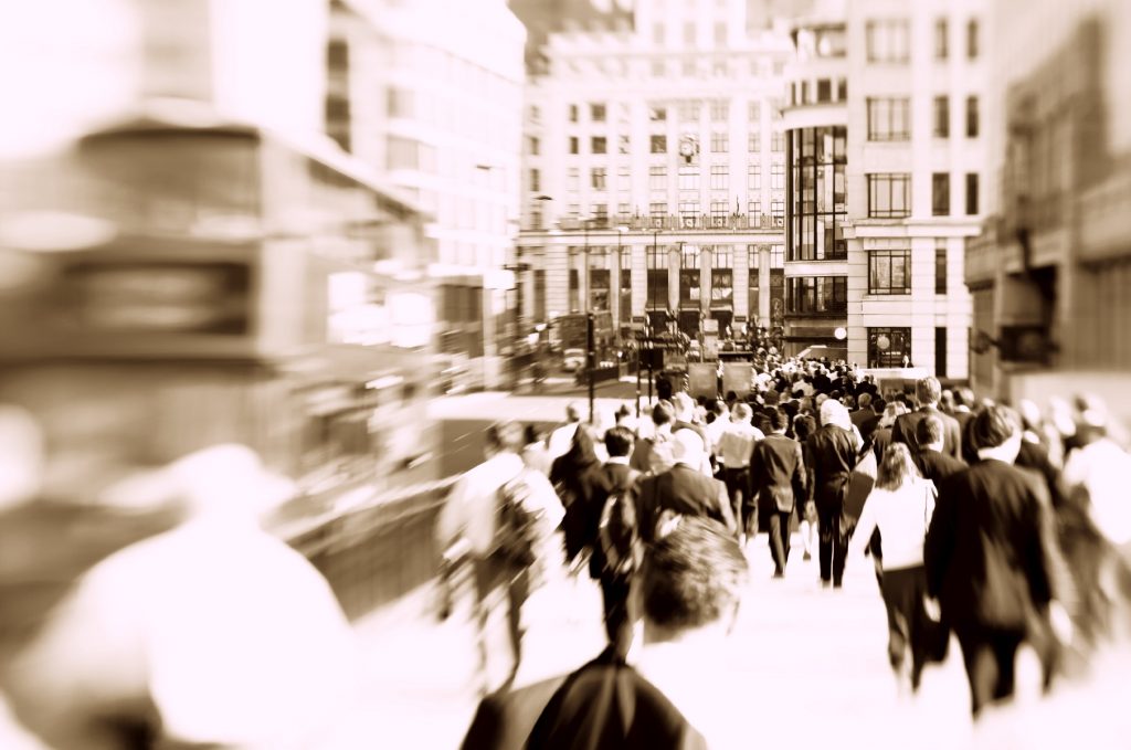 Blurred photograph of crowds walking through London