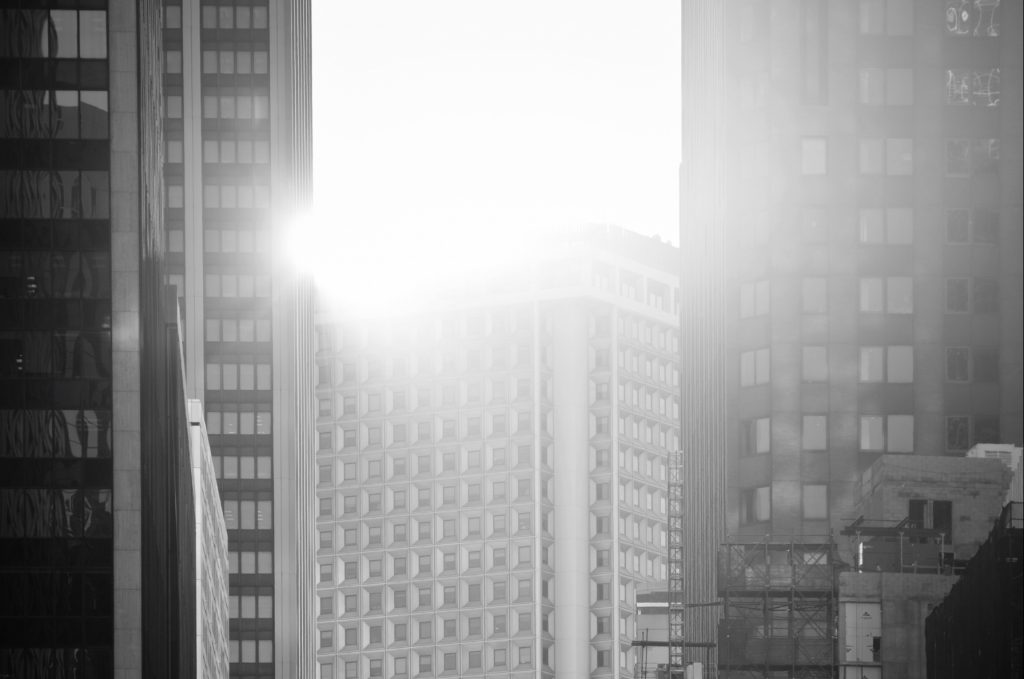 Sunlight coming through high rise buildings