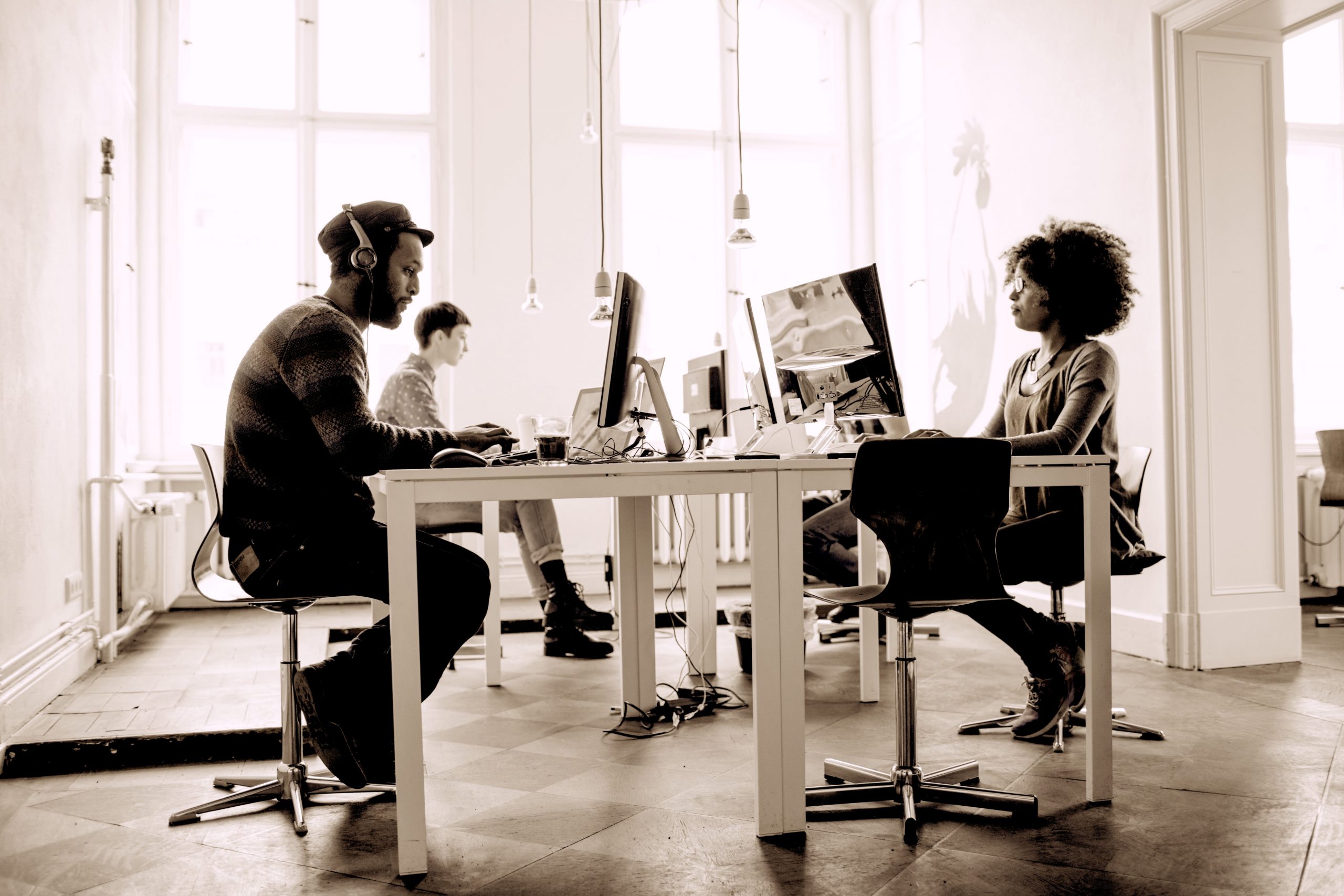 Young professionals working at desks in an office