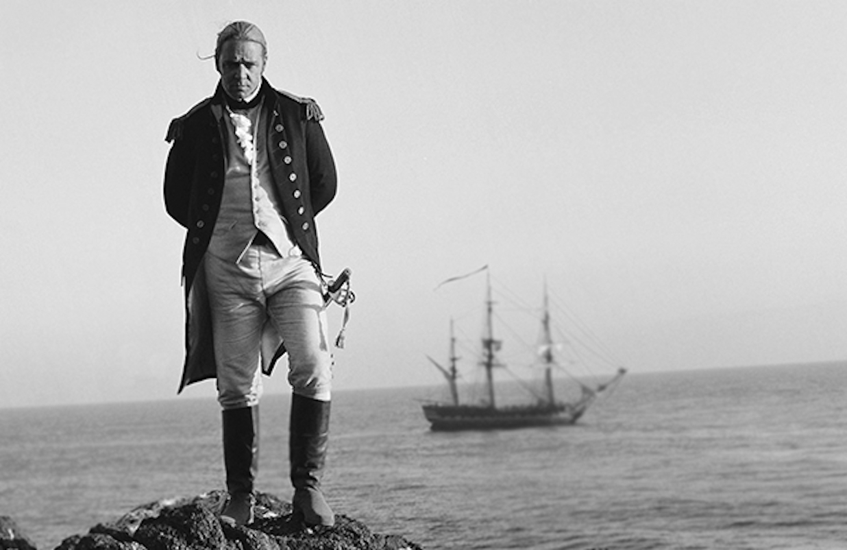 Film still from 'Master and Commander' showing a naval captain in front of his ship