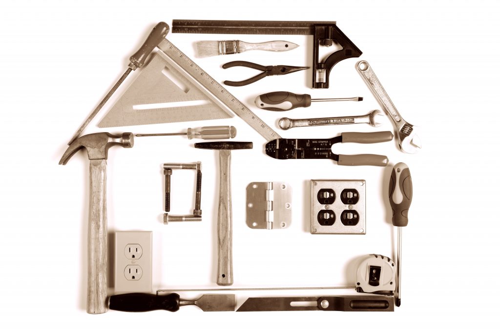 House made of tools over white background