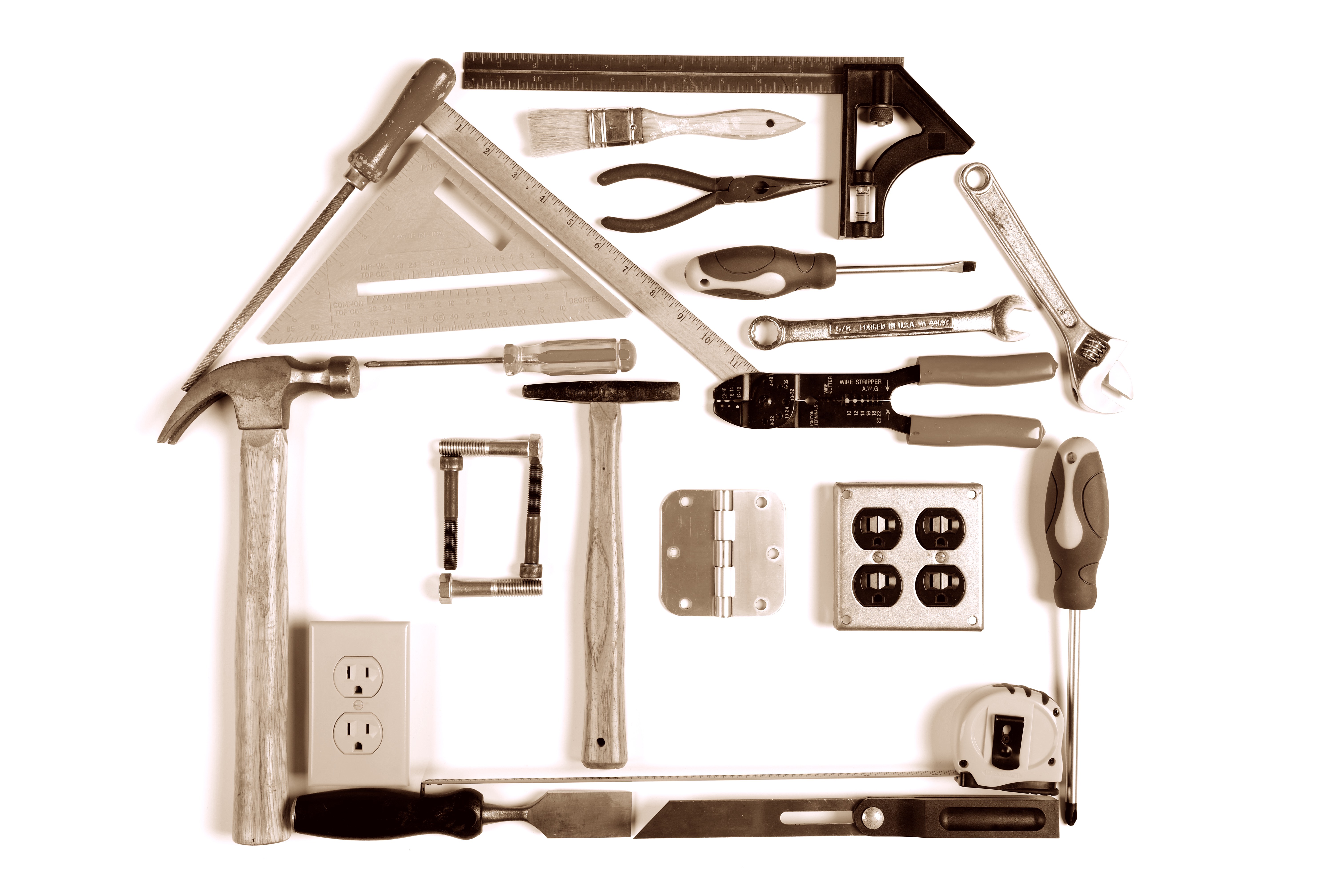 House made of tools over white background