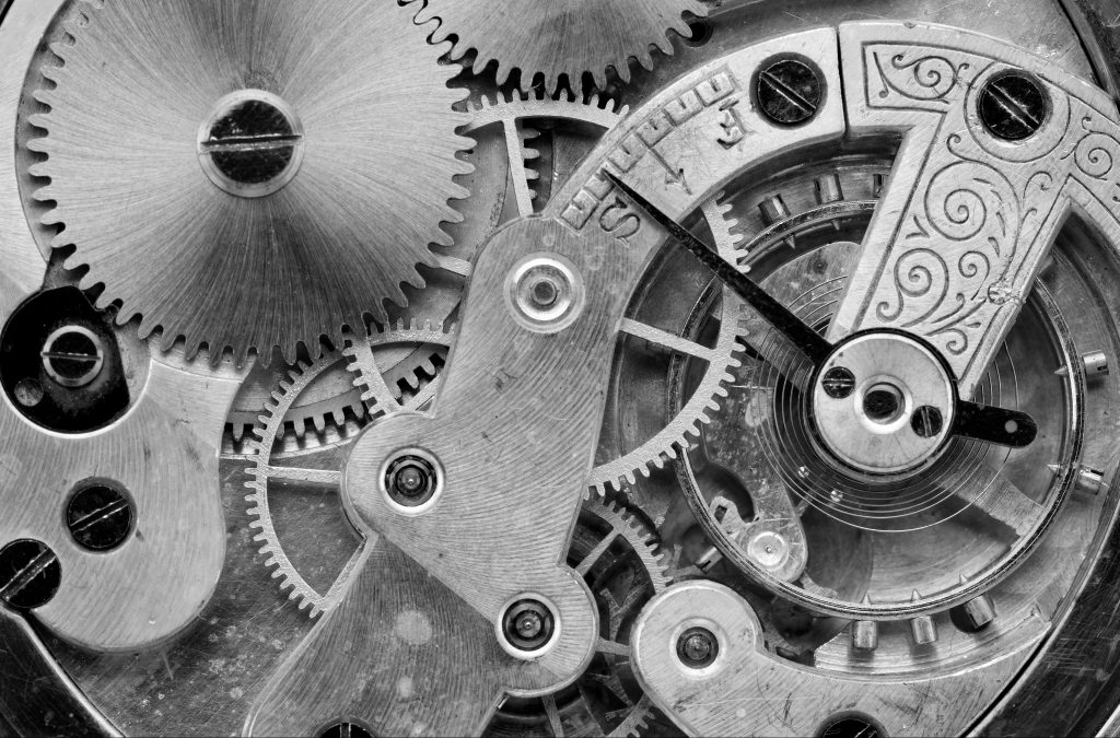 Gears of a vintage clock machinery, close up