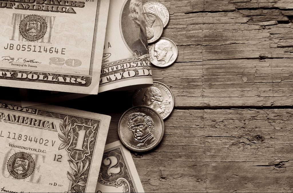 US dollars on a wooden table