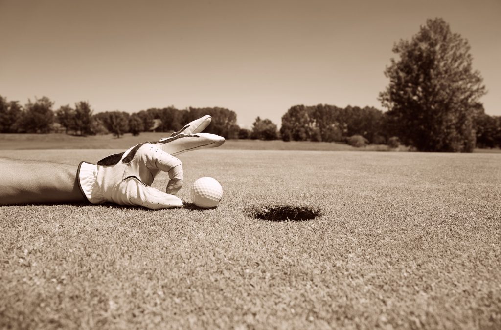 Golfer concentrating on the 19th hole