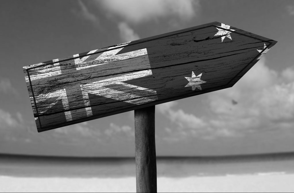 Sign showing Australian flag on a beach